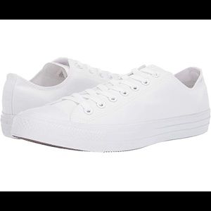 All white Converse low top sneakers